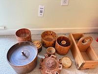 Full group of assorted wooden items on carpet