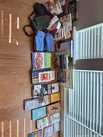 All items laid out showing books, linens and stand