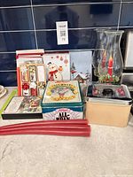 Group view showing tin, canister, candles, hurricane holder, and boxed cards