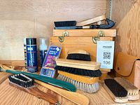 Overall lot showing brushes, sprays, shoeshine box, polish tins and accessories