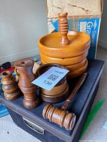 Group shot of coaster holder with lid, loose coasters, gavel, three candle holders