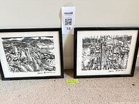 Both framed Sam Black prints side by side on floor