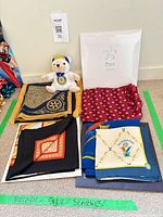 Group view of scarves and teddy bear