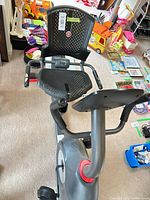 Overall view of Schwinn recumbent stationary bike showing seat, pedals, frame and console