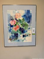 Front view of framed watercolor floral artwork