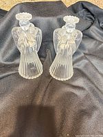 Front view of both frosted glass angel candle holders