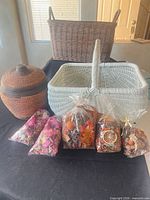 Group shot showing three baskets and five potpourri bags