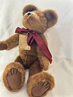 Front view of Boyds Bears plush bear showing ribbon and overall condition
