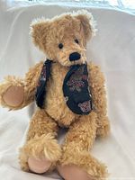 Front view of Boyd's Bears plush teddy bear seated, showing face, joints, and patterned vest