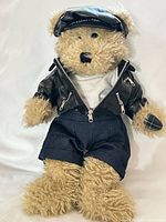 Front view of plush bear in biker outfit