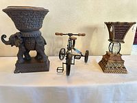 All three decorative items displayed on table