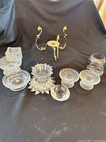 Group shot of assorted glass and metal candle holders