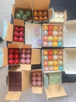 Overview of all open boxes of coloured candles