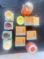 All candles laid out showing variety of jar, votive and boxed styles