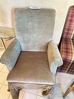 Front view of upholstered high-back armchair