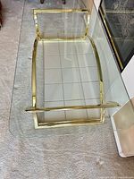 Top view showing glass surface and gold frame edges