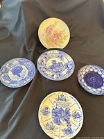 Five decorative plates front view showing patterns and designs