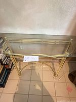 Front view of glass top console table showing full frame