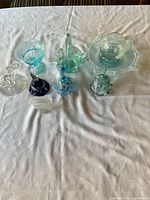 All eight glass items laid out on table