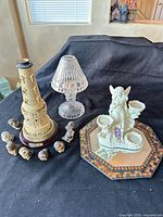 Group shot of lighthouse, crystal lamp, fairy candleholder on mirror tray, owl figurines