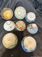 All eight bowls, exterior designs visible