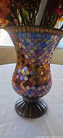 Close-up of mosaic pattern on vase