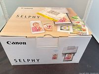 Closed Canon SELPHY CP1300 retail box top view