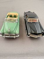 Front view of both model cars showing grille, headlights, overall color