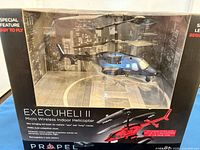 Front of sealed box showing helicopter and branding