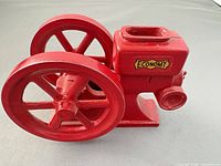 Left side view showing full model with flywheels and Economy decal