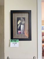 Close view of framed print with mat and frame