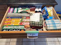 Drawer view of wraps, foils, mitts and cloths