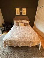 Made bed showing duvet cover, shams, pillows