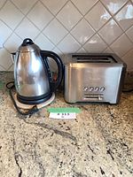Kettle and toaster side by side on counter