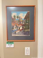Frontal view of framed painting on wall showing full artwork and frame