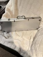 Closed aluminum case on fabric background