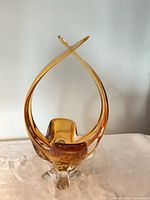 Front view showing full form, amber color, clear base