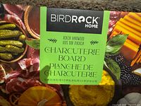 Close-up of BirdRock Home label on charcuterie board