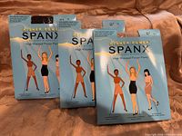 Four sealed boxes of Spanx Higher Power high-waisted Power Panty shown front view
