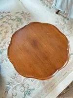 Top view showing scalloped mahogany surface with wear marks