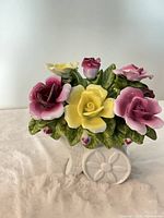 Front view of porcelain rose basket figurine