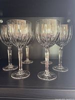 Six Waterford Marquis crystal wine glasses inside cabinet