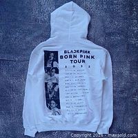 Back view showing Born Pink 2022 tour graphic and member photos