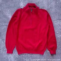 Front view of red Burberry quarter-zip children’s sweater