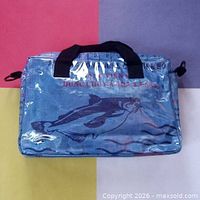 Front view showing catfish graphic, blue colour, handles