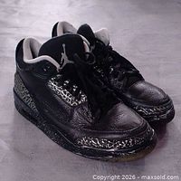 Front angled view of both shoes showing overall appearance and custom paint