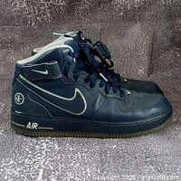 Left side view of both blue Nike Air Force 1 Mid sneakers