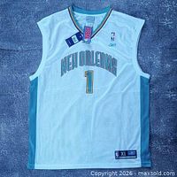 Front view showing NEW ORLEANS text, number 1, Reebok and NBA logos, hang tags visible
