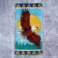 Full view of rectangular latch hook rug showing eagle, sun and borders