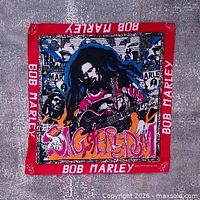 Full view front of bandana showing graphic and border text